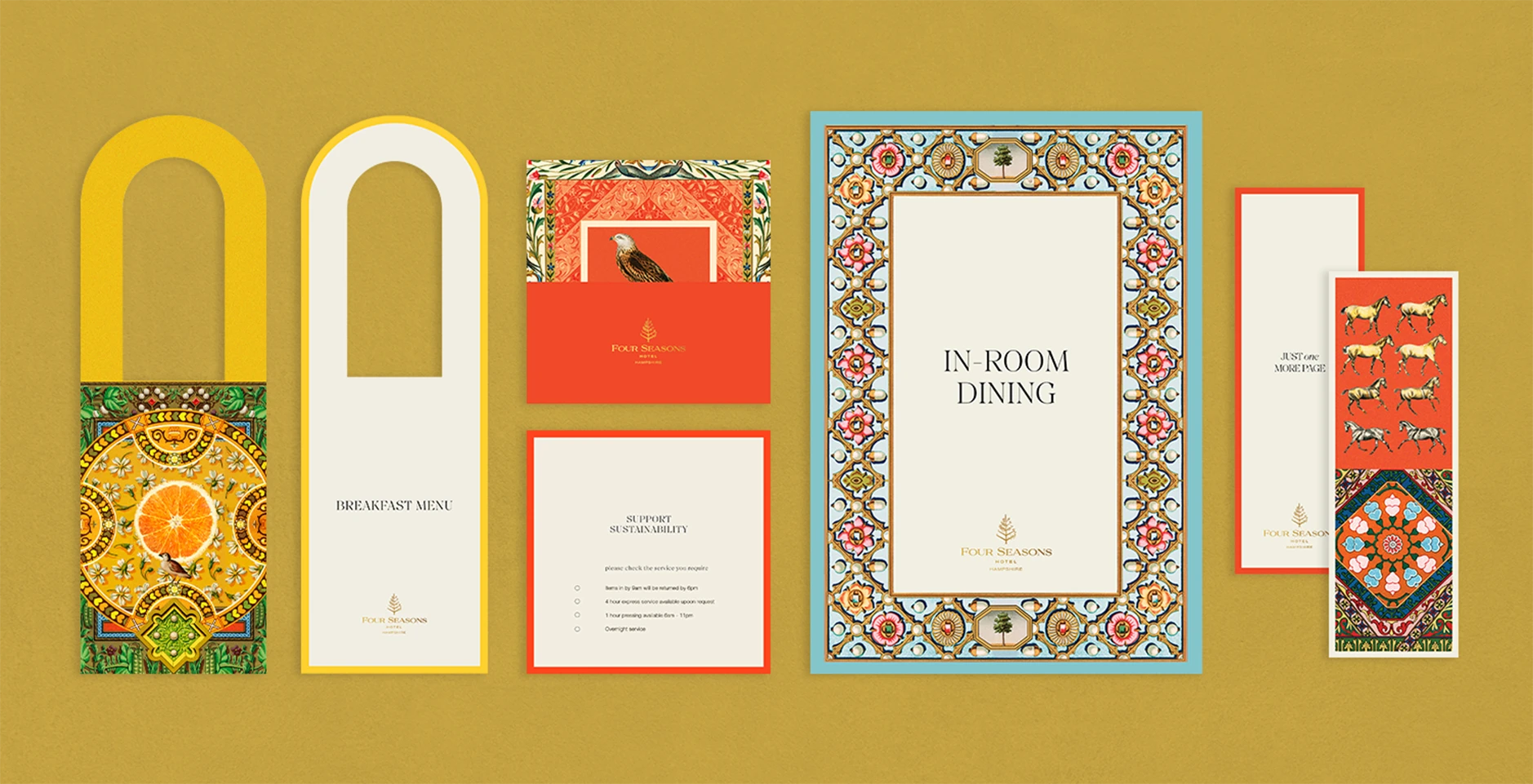 Flat lay of Four Seasons property collateral including in-room dining menu, breakfast menu, door hanger, and illustrated printed cards