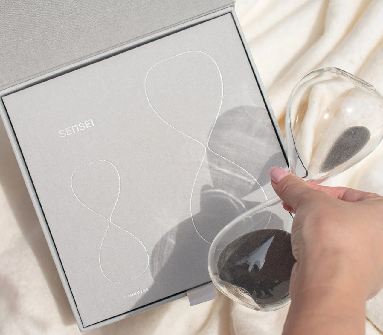 Sensei Hourglass of Intention gift packaging with glass hourglass and minimal branded box design