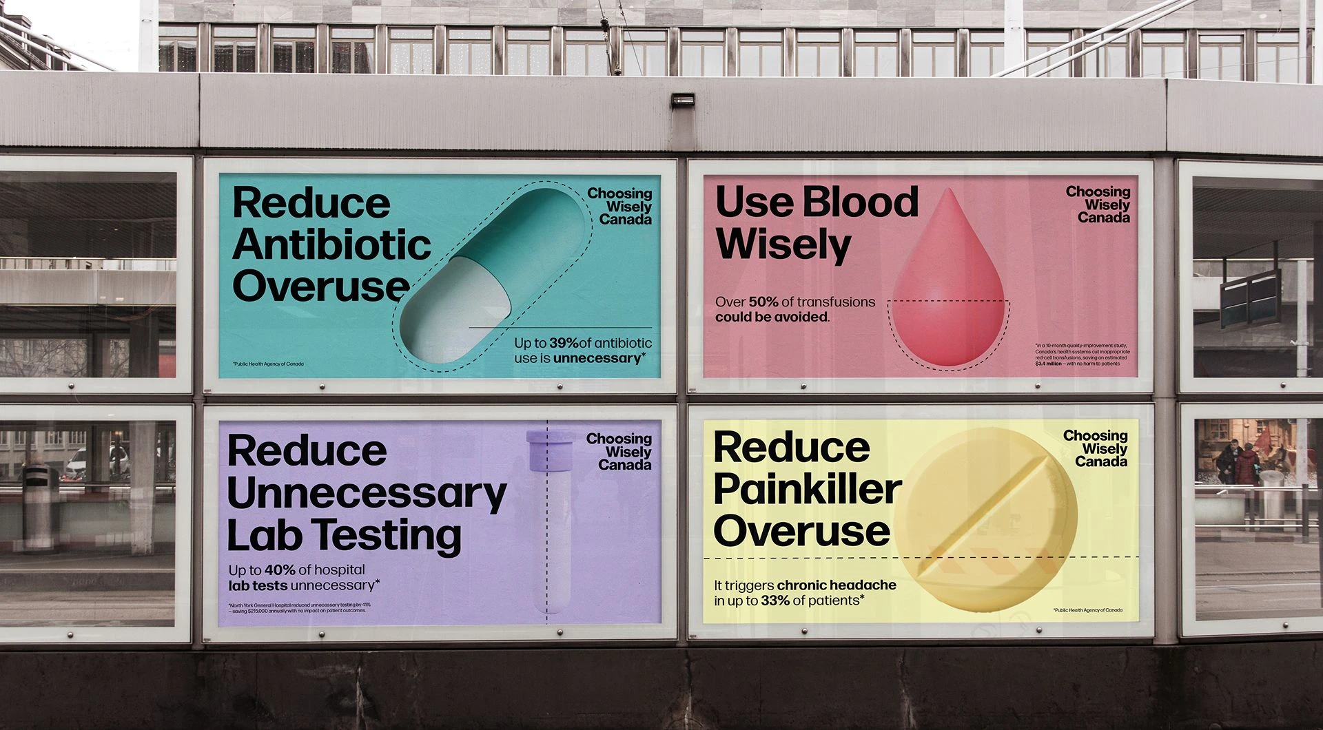 Environmental signage featuring four Choosing Wisely Canada health posters about antibiotic overuse, blood use, lab testing, and painkiller overuse displayed on an outdoor structure.
